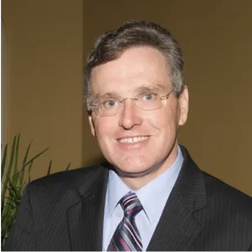 Professional portrait of Florida attorney Dennis S. Moses in business attire